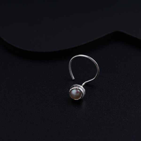 a close up of a ring on a black surface