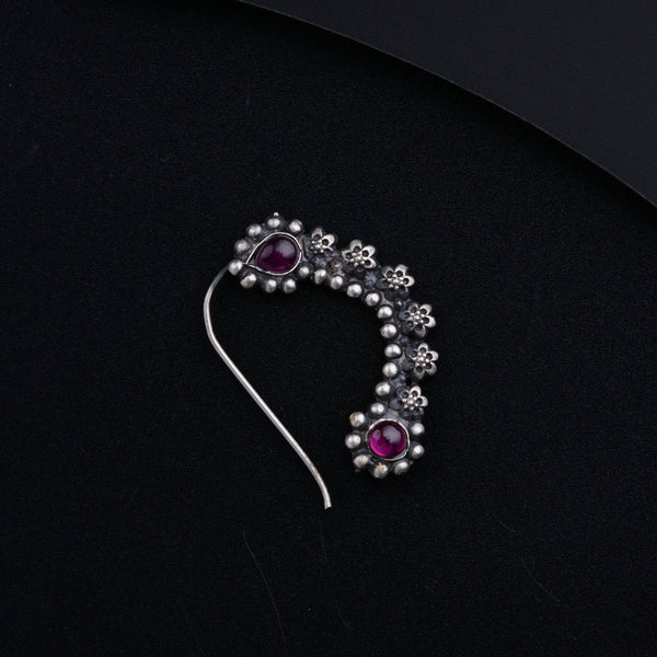 a brooch with a bunch of beads on it