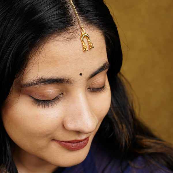 a close up of a person wearing a head piece