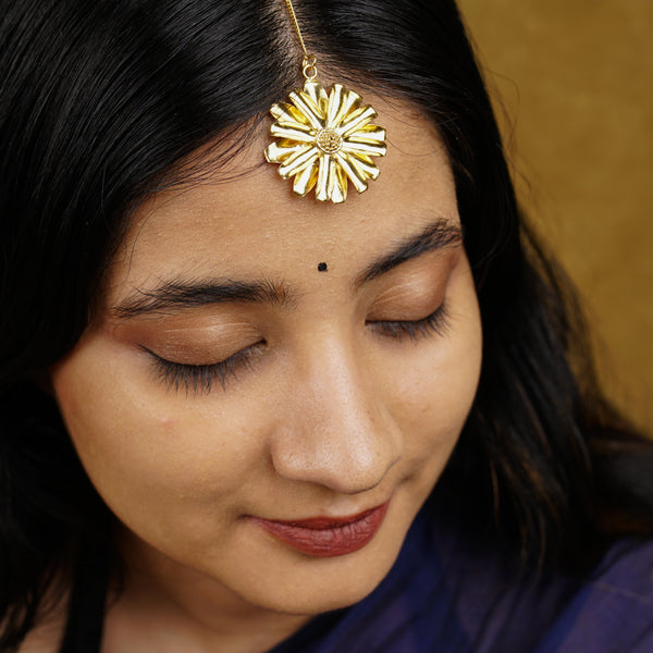 a close up of a person wearing a head piece