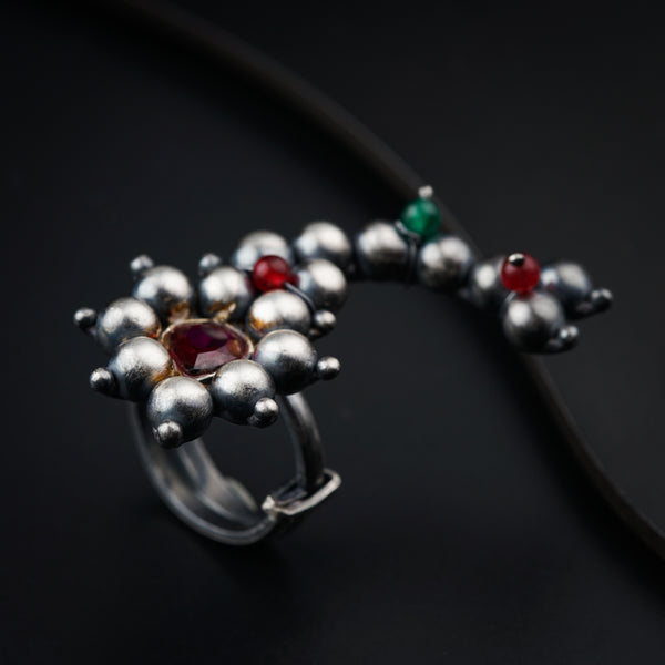 a close up of a ring on a black surface