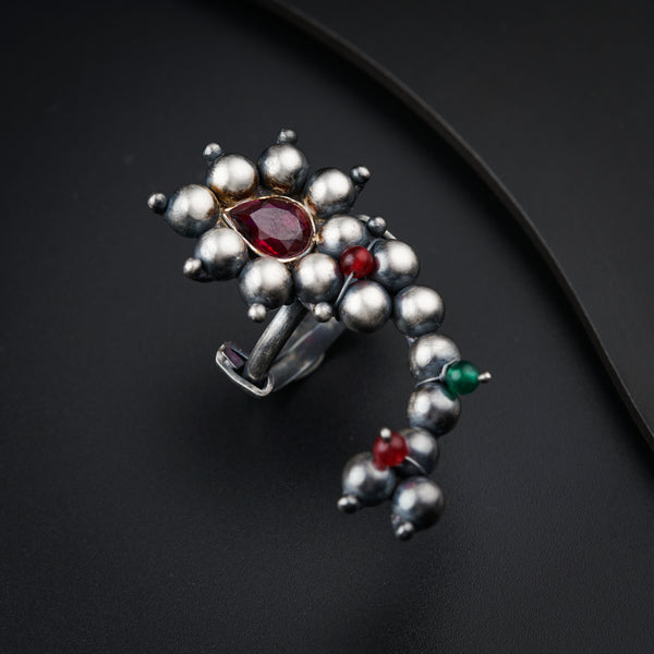 a close up of a ring on a black surface