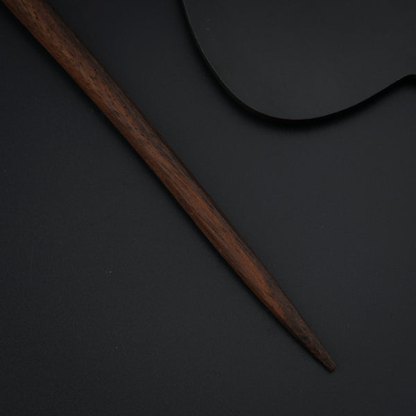 a baseball bat and a ball on a table