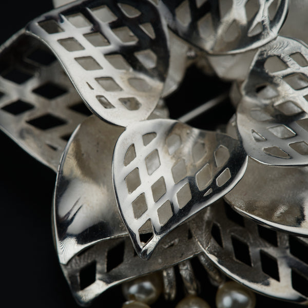a close up of a metal object on a black background