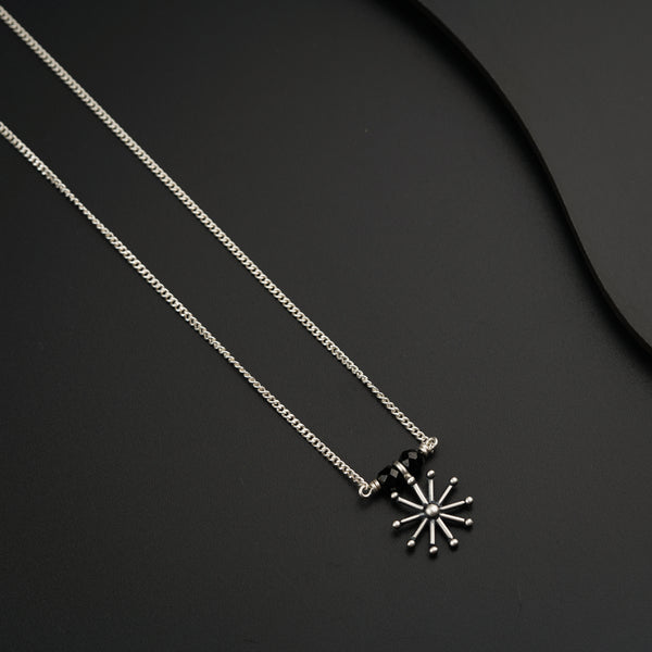 a couple of necklaces sitting on top of a table