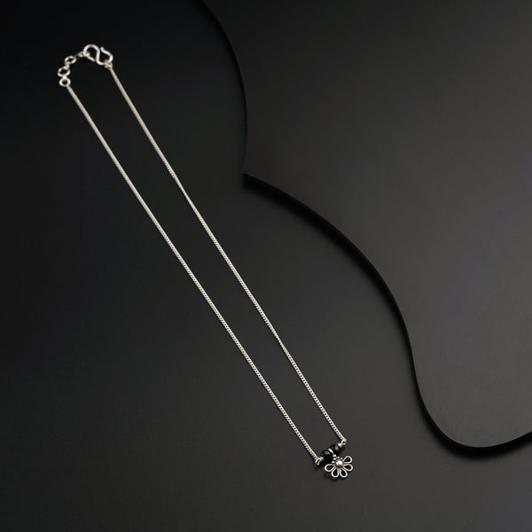 a couple of necklaces sitting on top of a table
