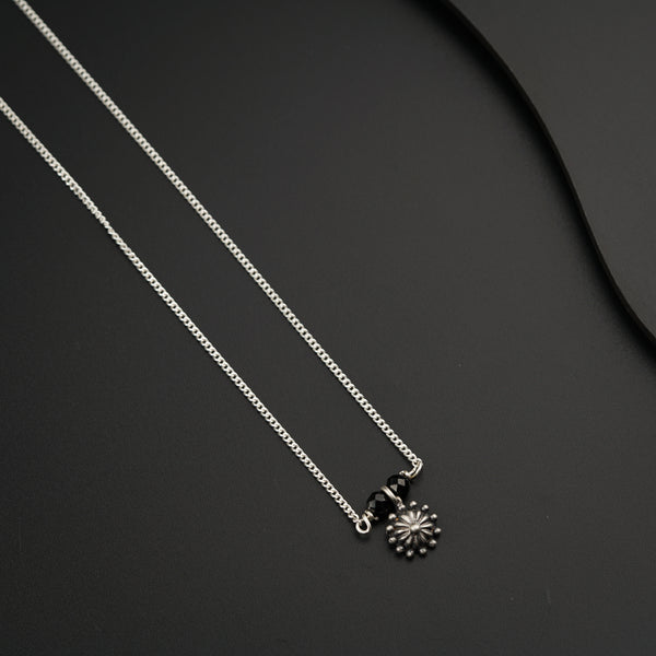 a couple of necklaces sitting on top of a table