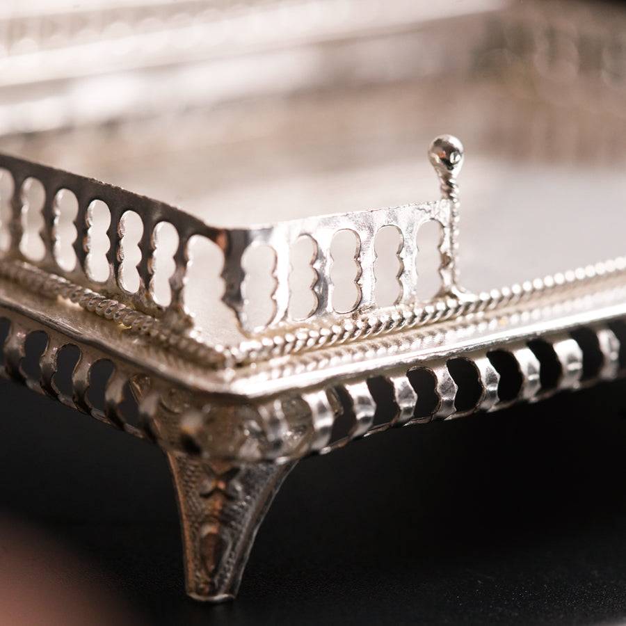 a close up of a metal tray on a table