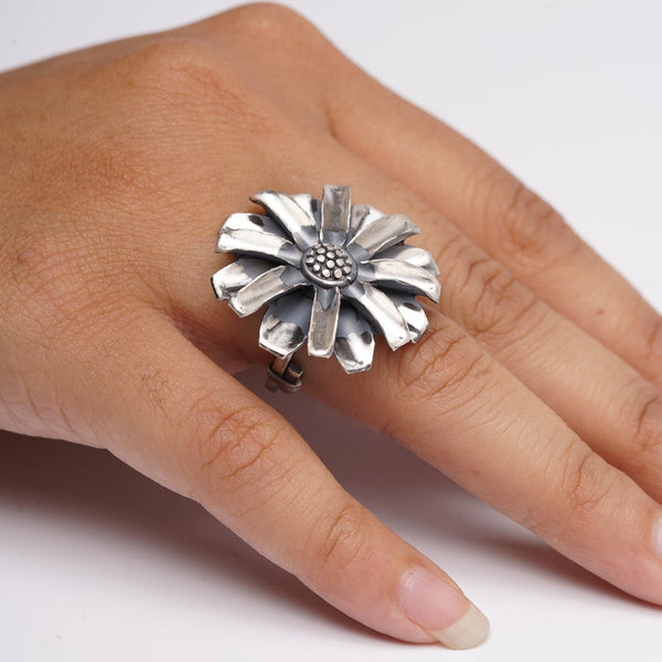 a woman's hand with a ring on it