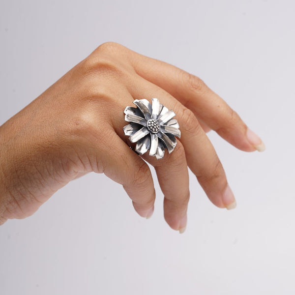 a woman's hand with a ring on it