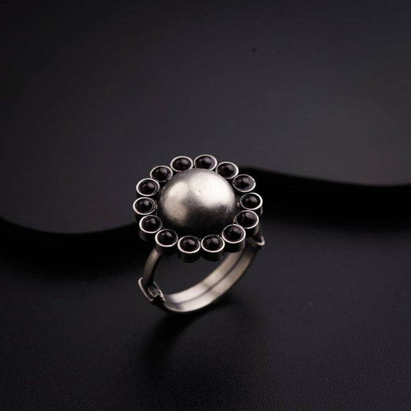 a close up of a ring on a black surface