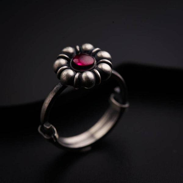 a close up of a ring on a black surface