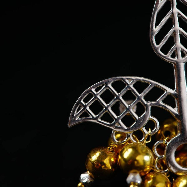 a close up of a metal object on a black background