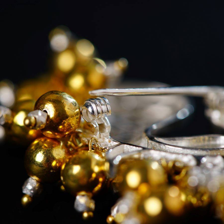 a close up of a pair of gold and silver rings