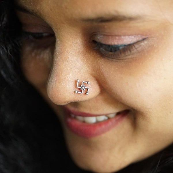a close up of a person with a nose piercing