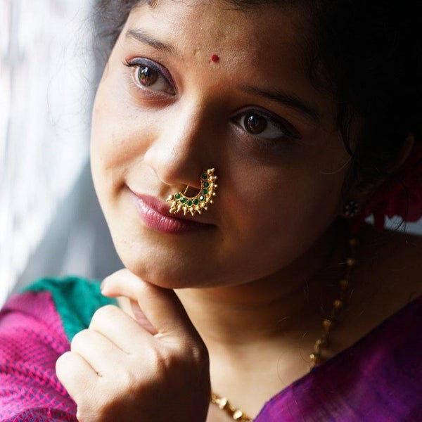 a woman with a nose ring and a nose ring