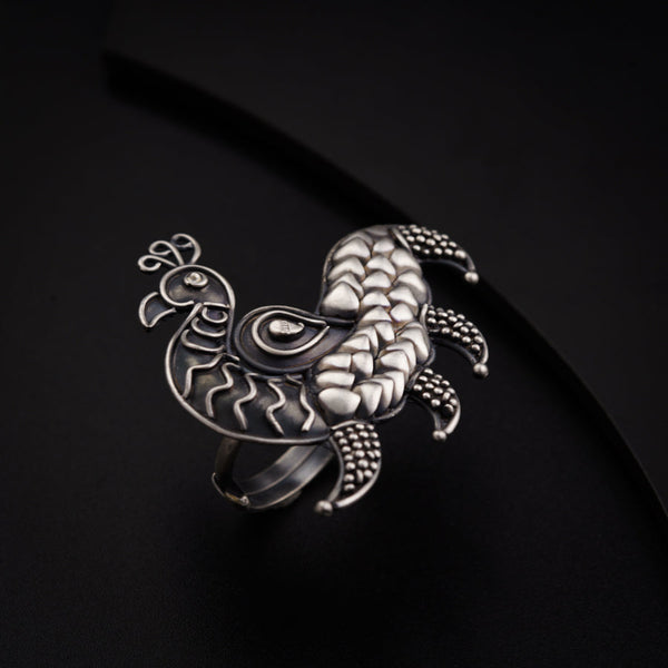 a close up of a metal object on a black surface