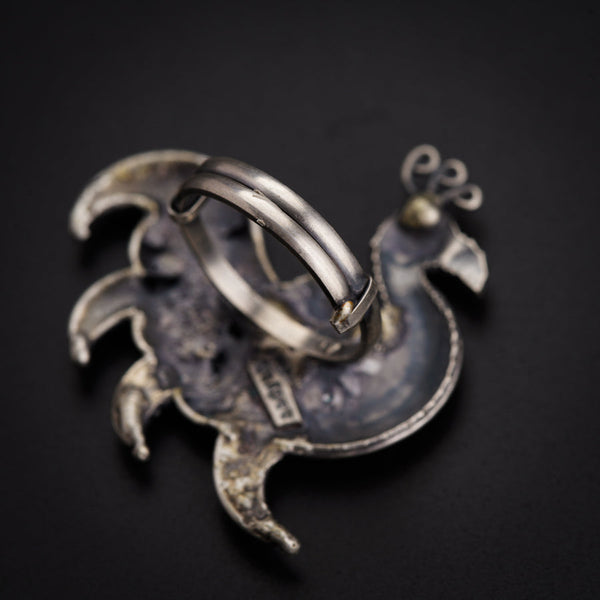 a couple of rings sitting on top of a metal object