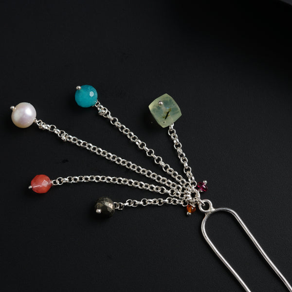 a bunch of different colored beads on a chain