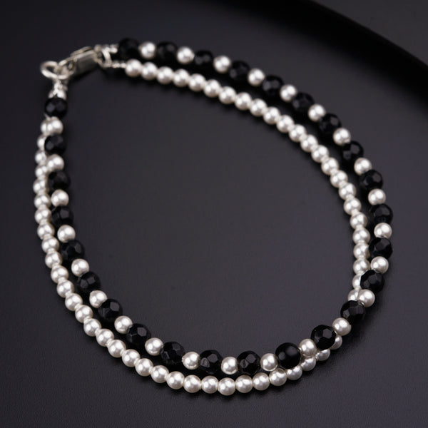 a close up of a necklace on a table