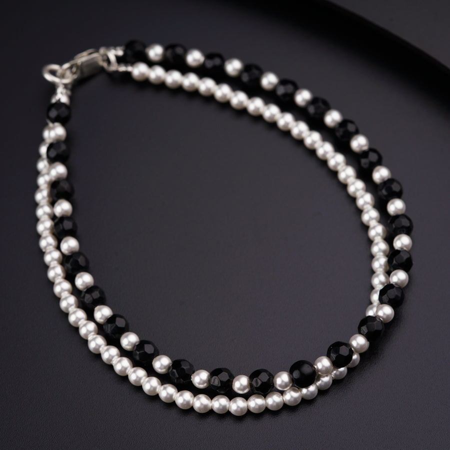 a close up of a necklace on a table