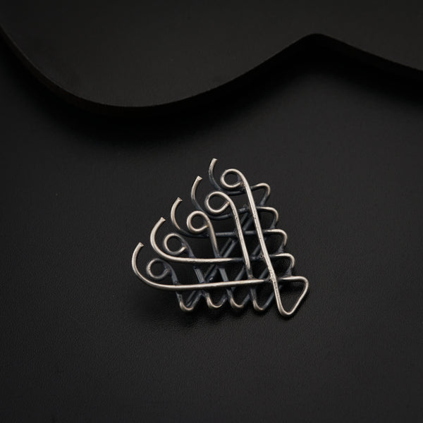 a brooch that is sitting on a table