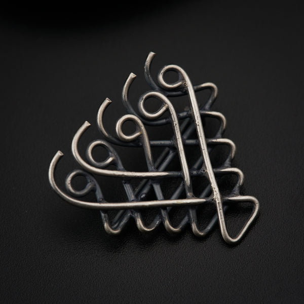 a close up of a metal object on a black surface