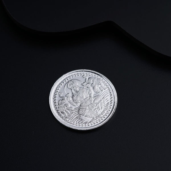 a close up of a coin on a black surface