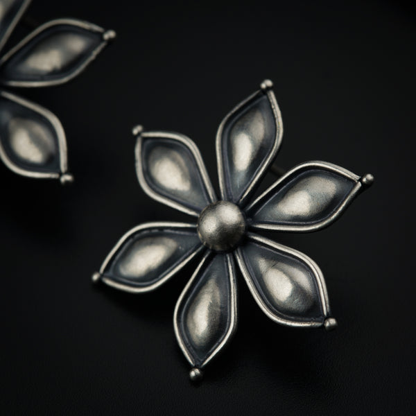a close up of a metal object on a black surface