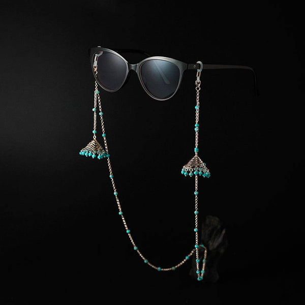 a pair of sunglasses hanging from a chain