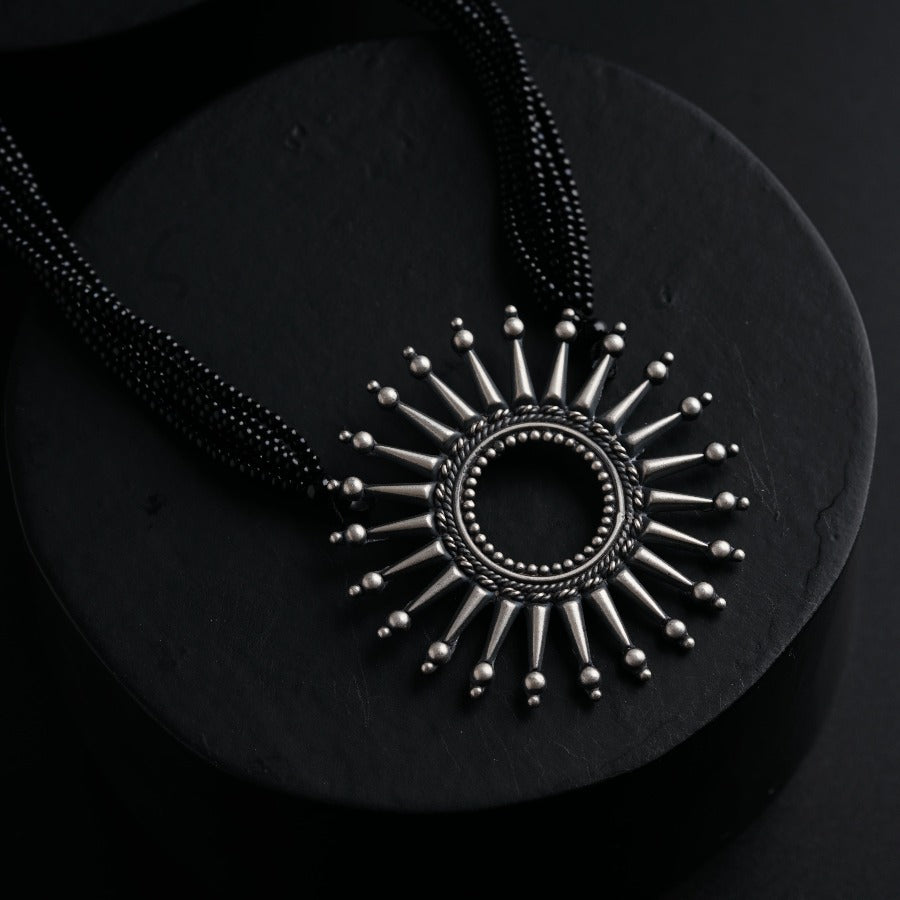 a necklace with a circular design on it