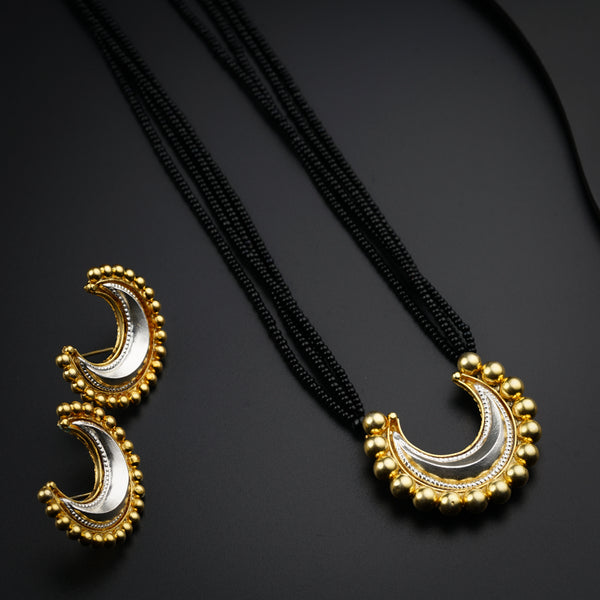 a couple of necklaces sitting on top of a table