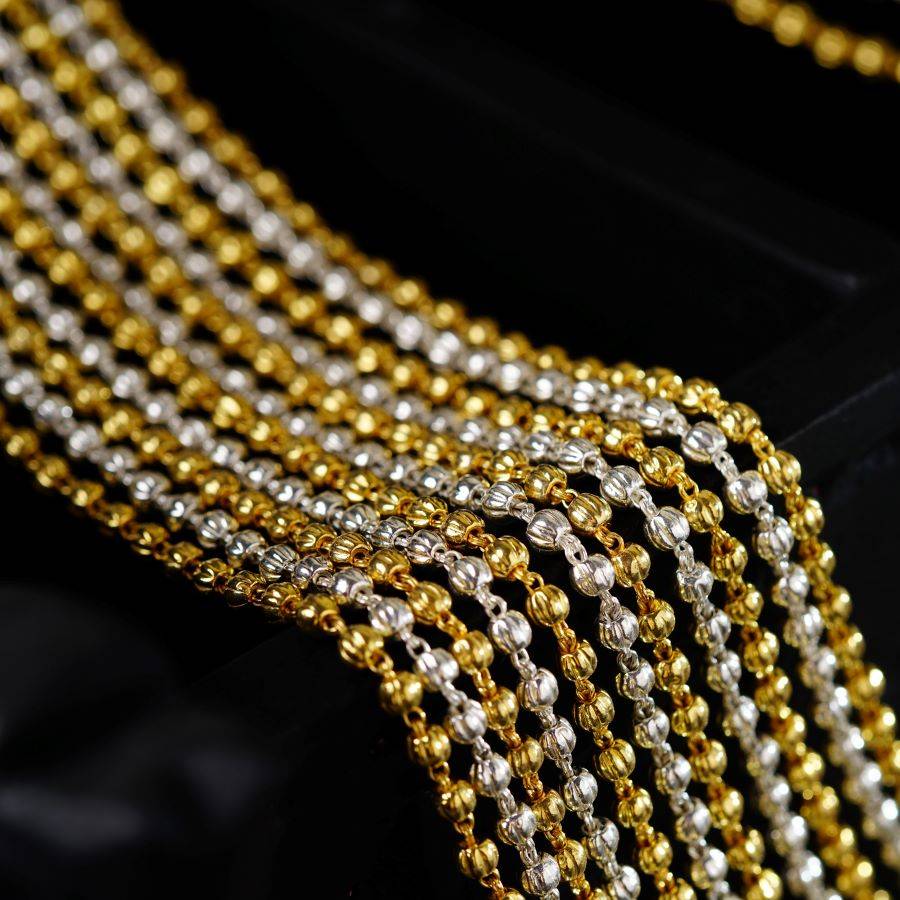 a close up of a gold and silver chain