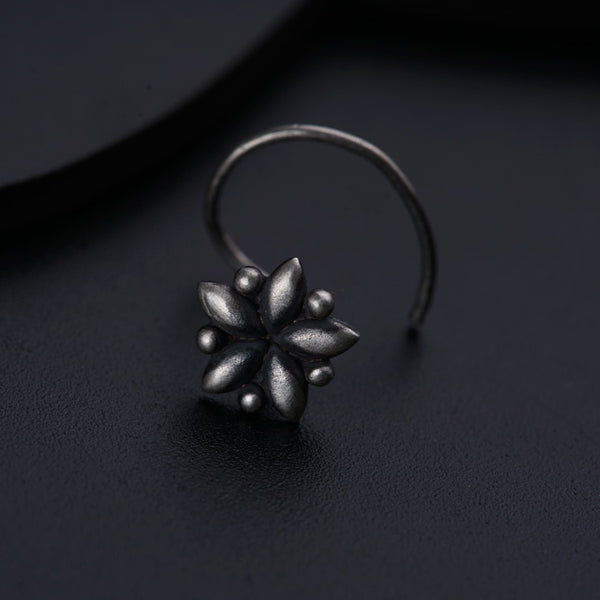 a close up of a ring on a black surface