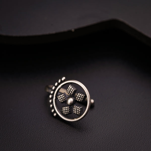 a close up of a ring on a black surface