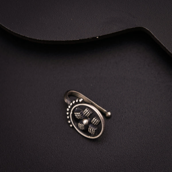 a close up of a metal object on a black surface