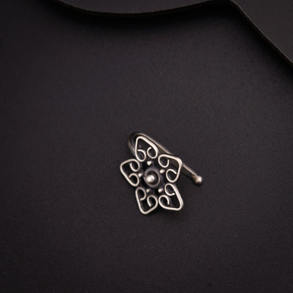 a close up of a metal object on a black surface
