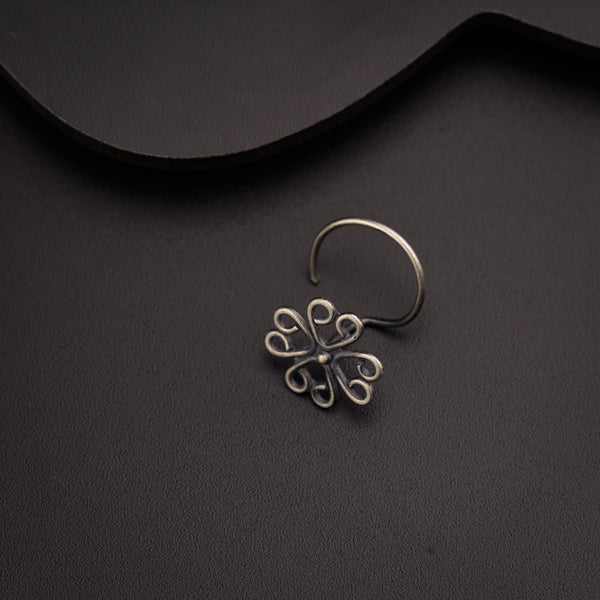 a close up of a ring on a black surface