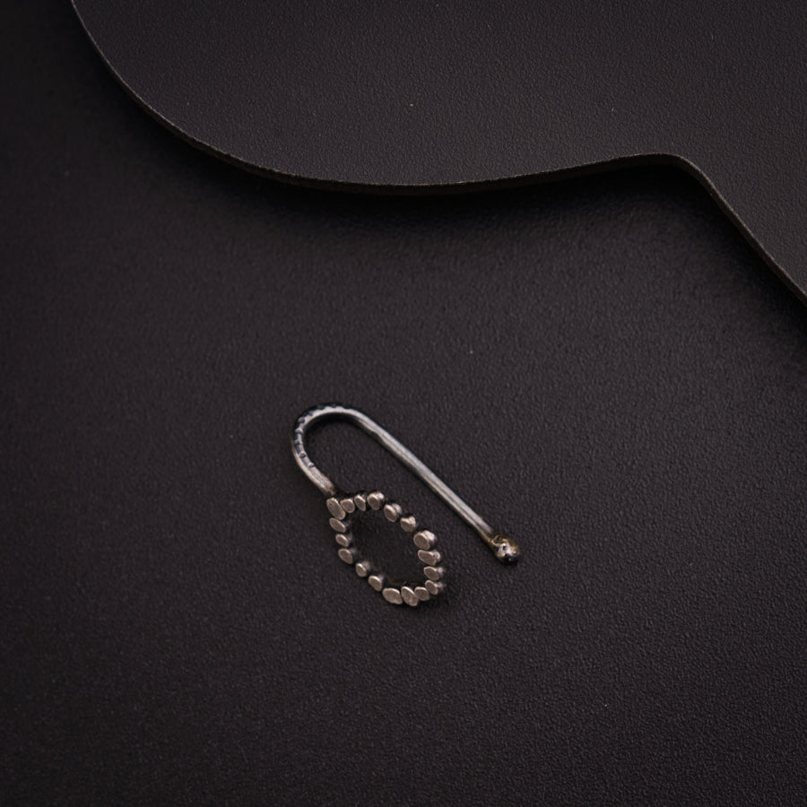 a pair of scissors sitting on top of a black surface