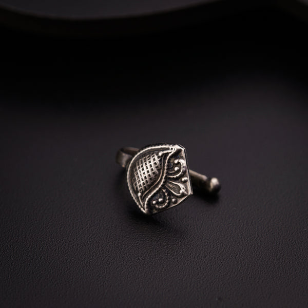 a close up of a ring on a black surface