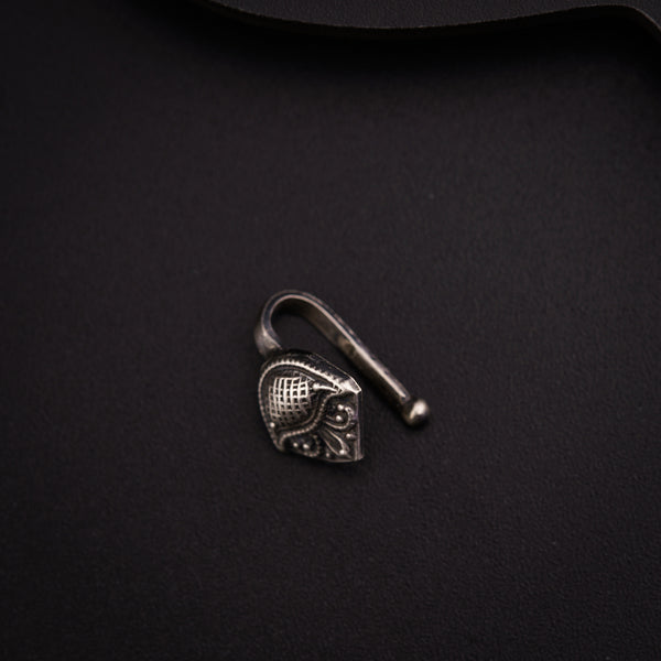 a metal hook with a heart on it