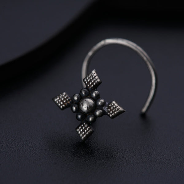 a close up of a ring on a black surface