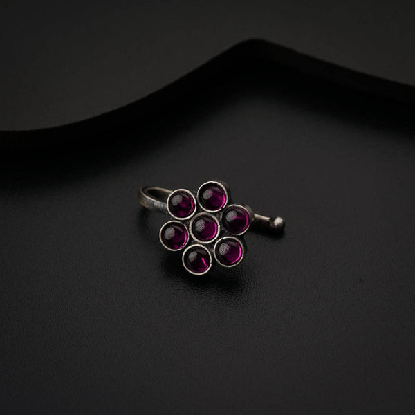 a close up of a ring on a black surface