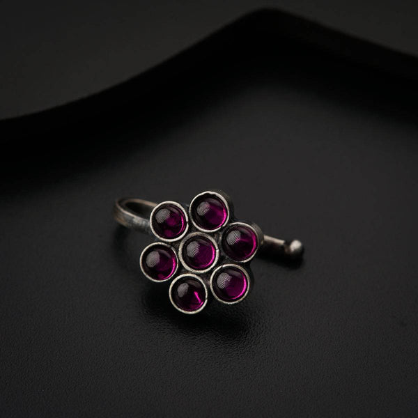 a close up of a ring on a black surface