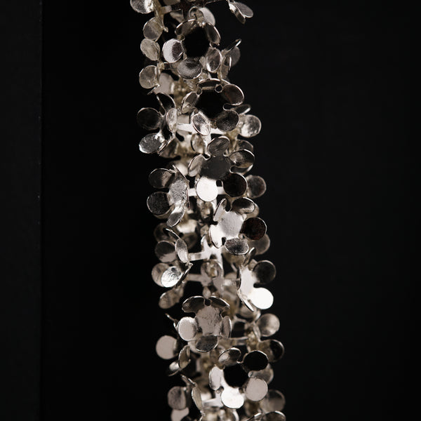 a bunch of glass beads hanging from the ceiling