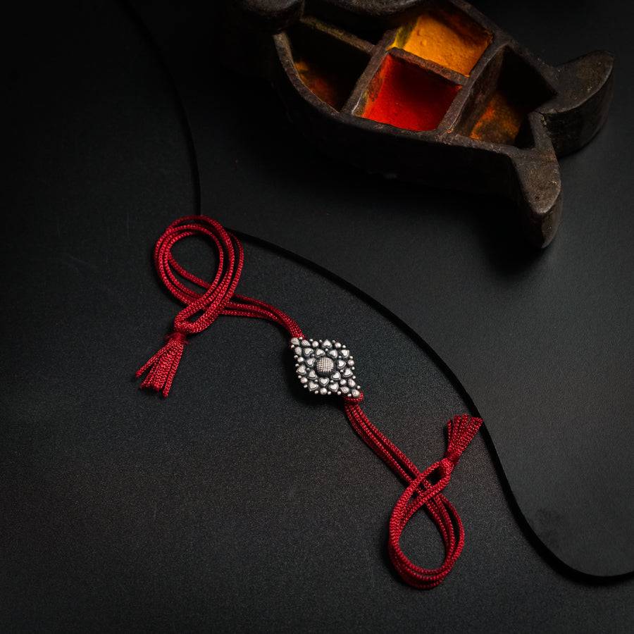 Handcrafted Silver Rakhi/Pendant: Tiny Heart
