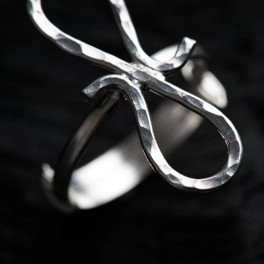 a close up of a metal object with a black background
