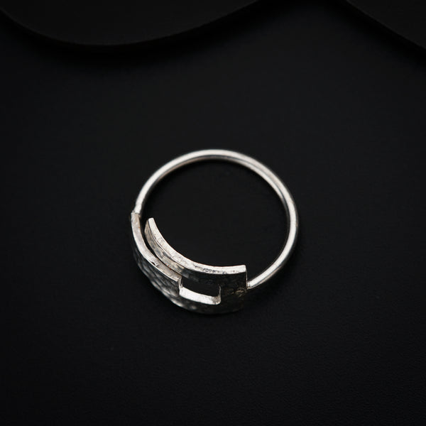 a close up of a ring on a black surface