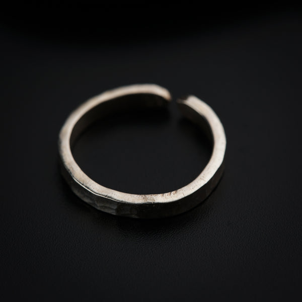 a close up of a ring on a black surface