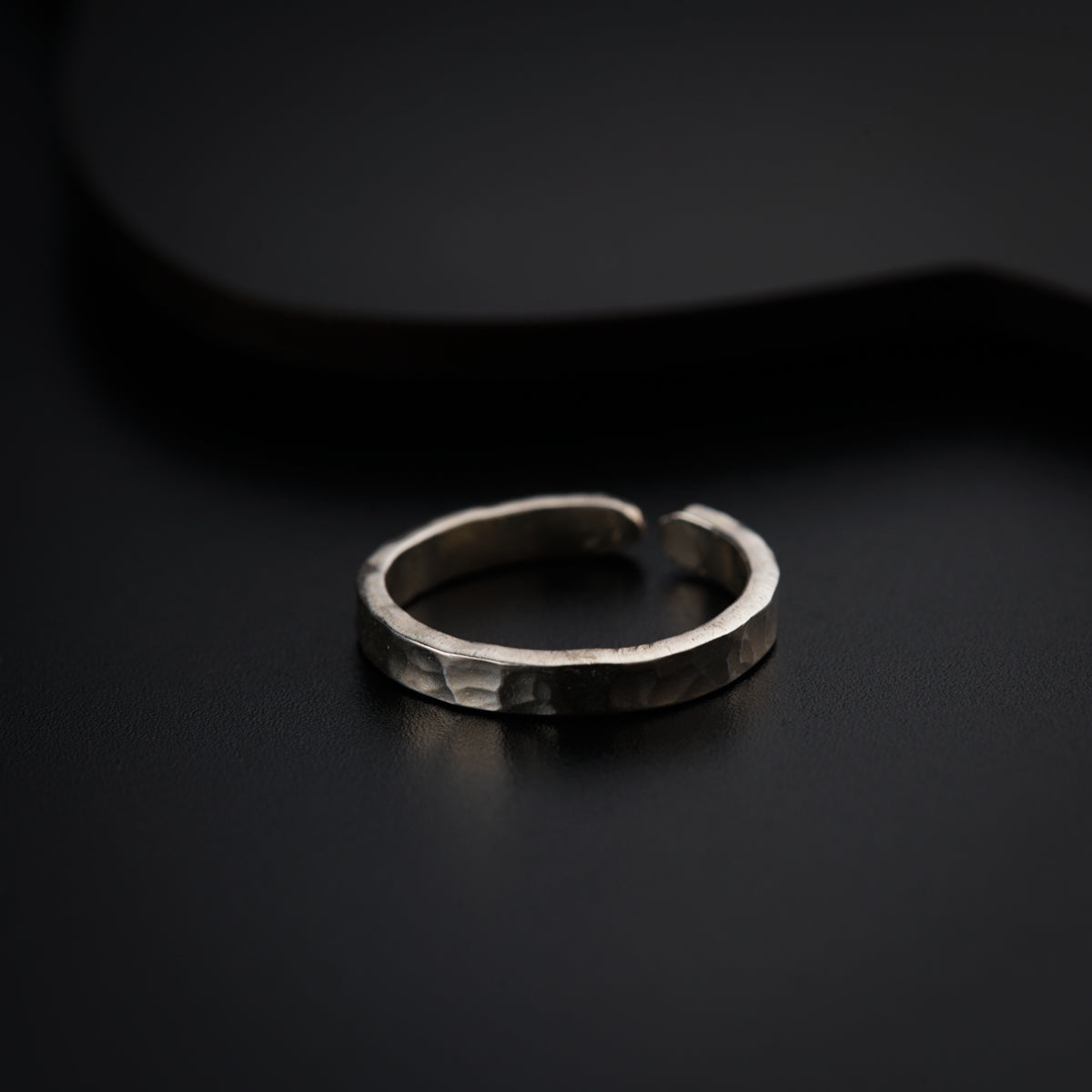 a close up of a ring on a black surface